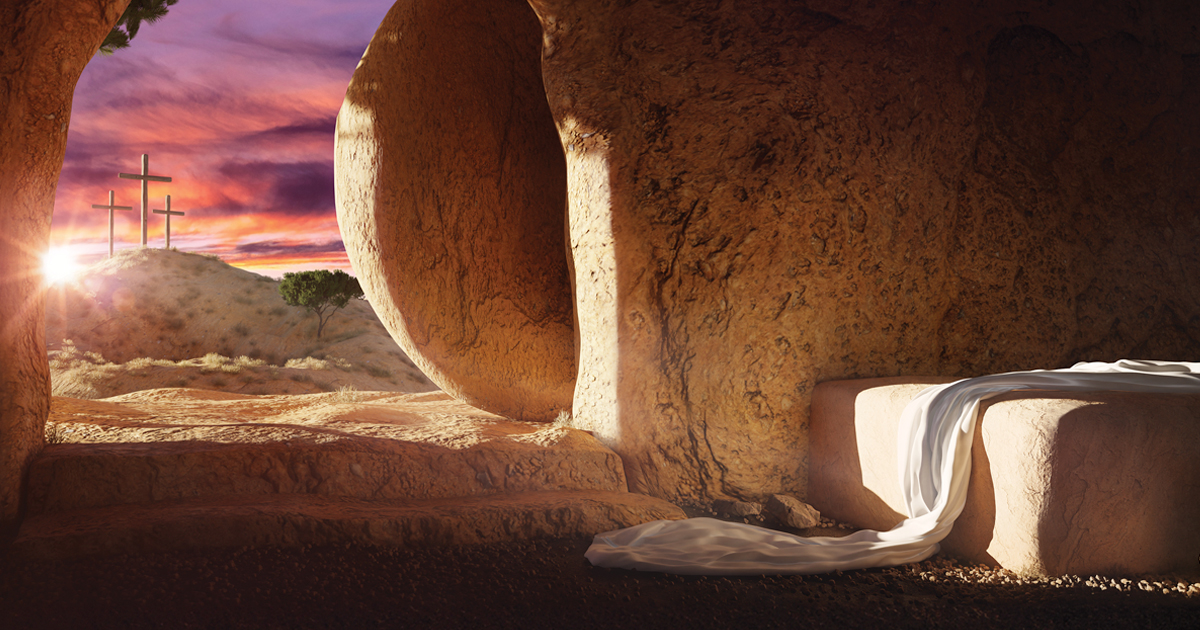 Empty tomb with three crosses in the background