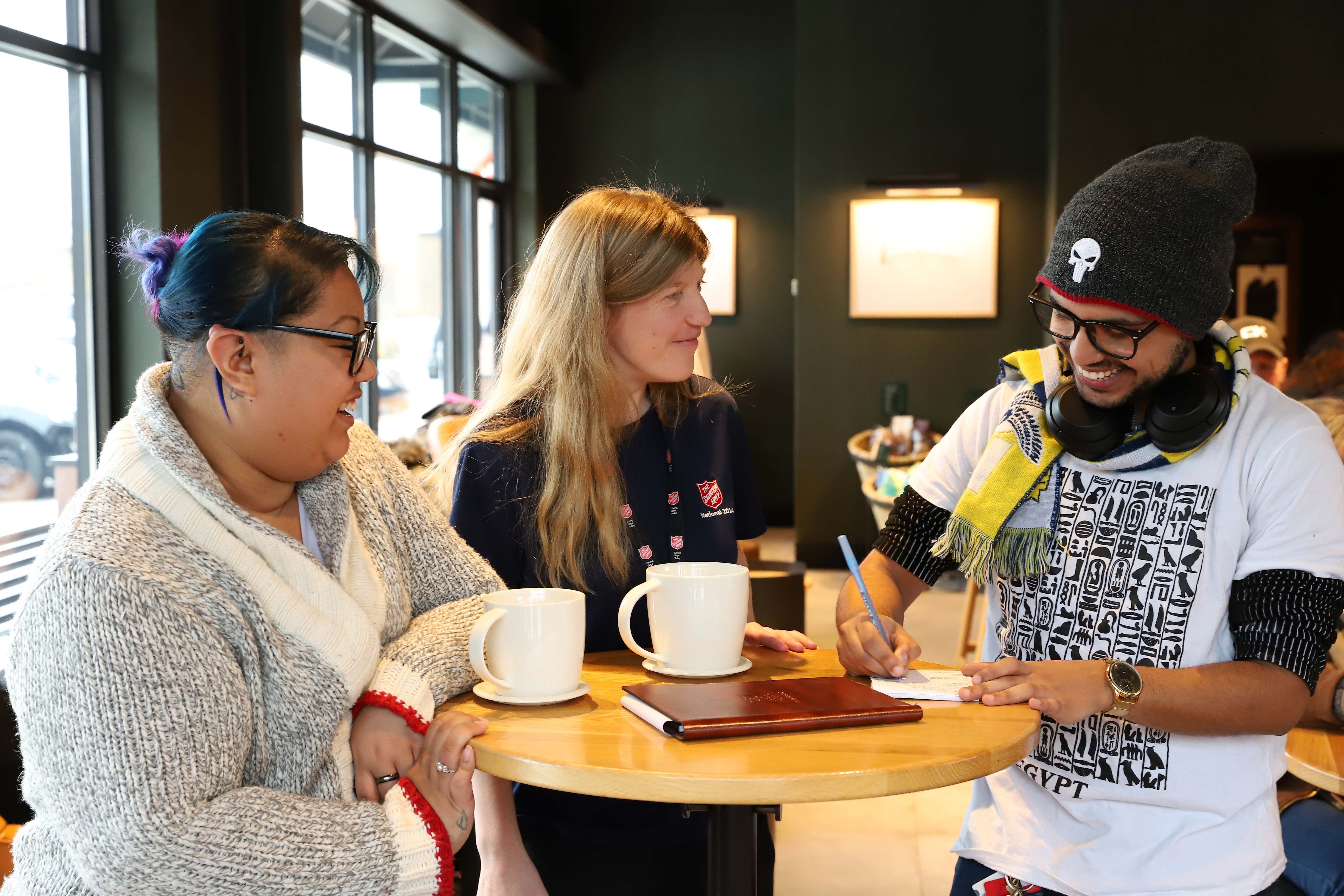 Group of adults sitting together and talking.